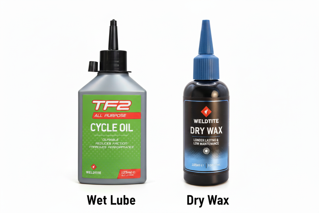 Weldtite TF2 wet lube and dry wax chain lubricants side by side — Peak Bike Station