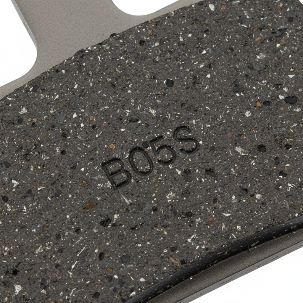 Macro close-up of Shimano B05S resin disc brake pad friction surface showing B05S branding